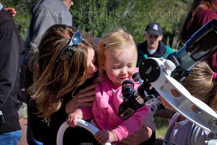 Child looking in telescope