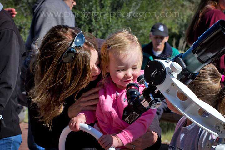 Child looking in telescope Child looking in telescope